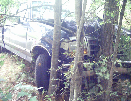 Truck Pulling TRactor hits tree
